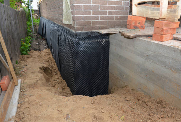 Happy homeowners after waterproofing job in Stryker
